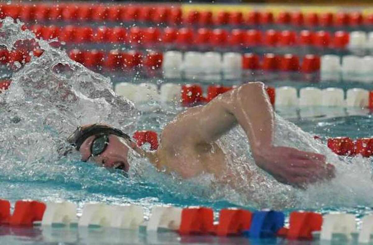 Ridgefield sophomore Connor Hunt swims to first place in the 500-yard freestyle at the FCIAC championship meet. Hunt also triumphed in the 200 freestyle. Photo: Gregory Vasil / Hearst Connecticut Media