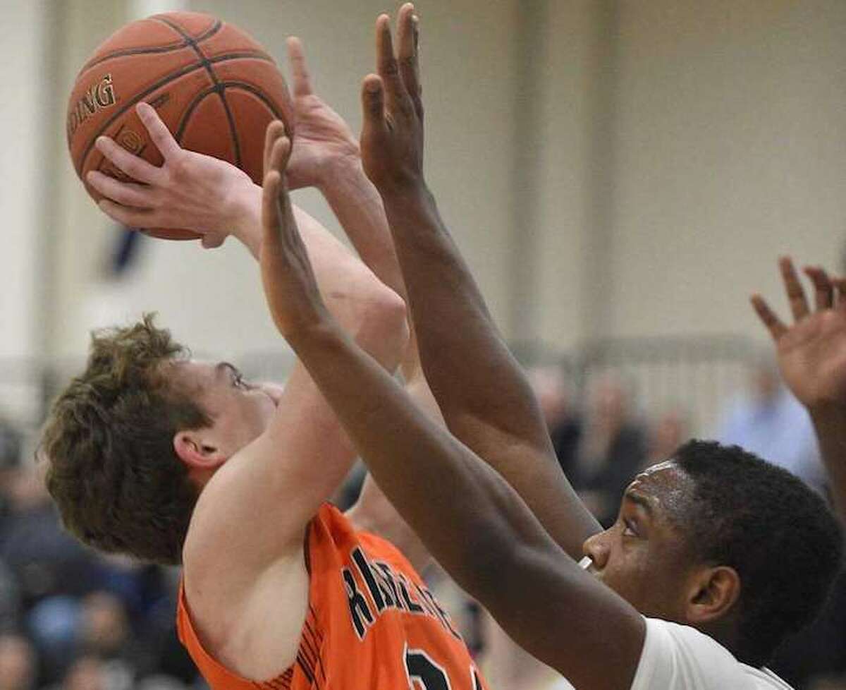 James St. Pierre scored a game-high 23 points as Ridgefield beat Trumbull in the FCIAC semifinals. Photo: Erik Trautmann / Hearst Connecticut Media