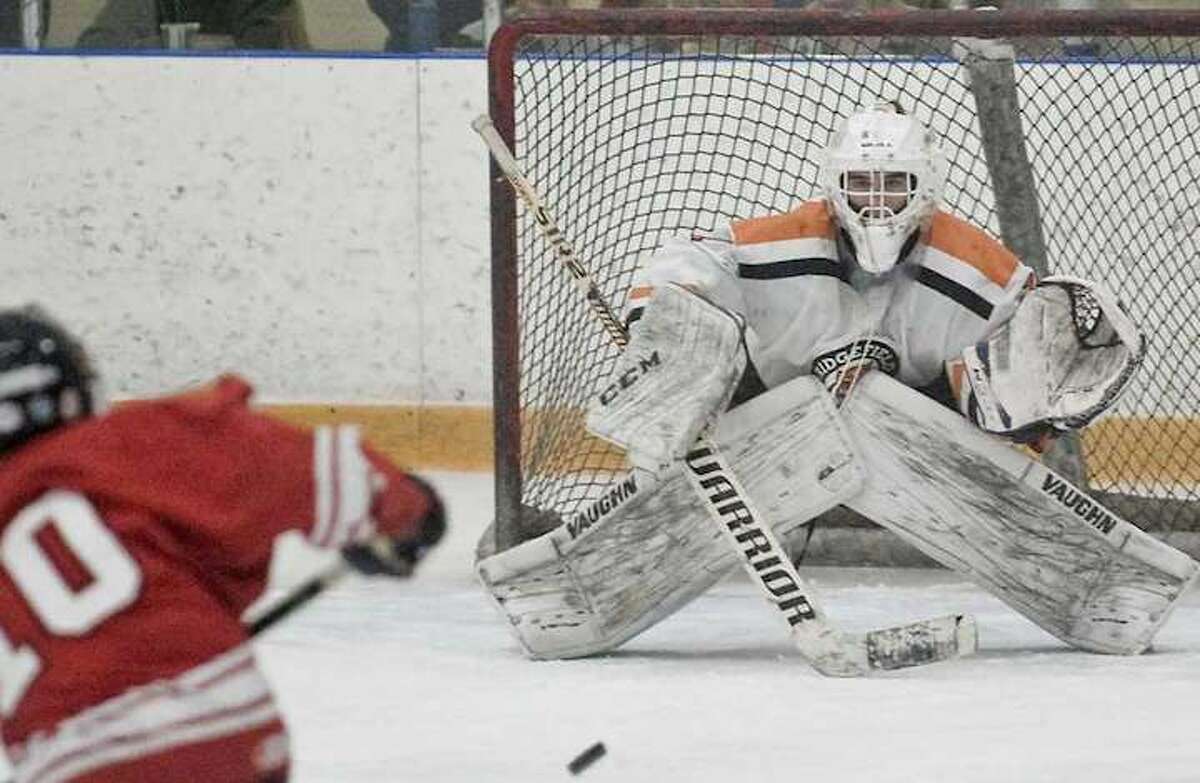 Goalie Sean Gordon and the Ridgefield boys hockey team take a 20-0-0 record into the postseason. Photo: Scott Mullin / Hearst Connecticut Media