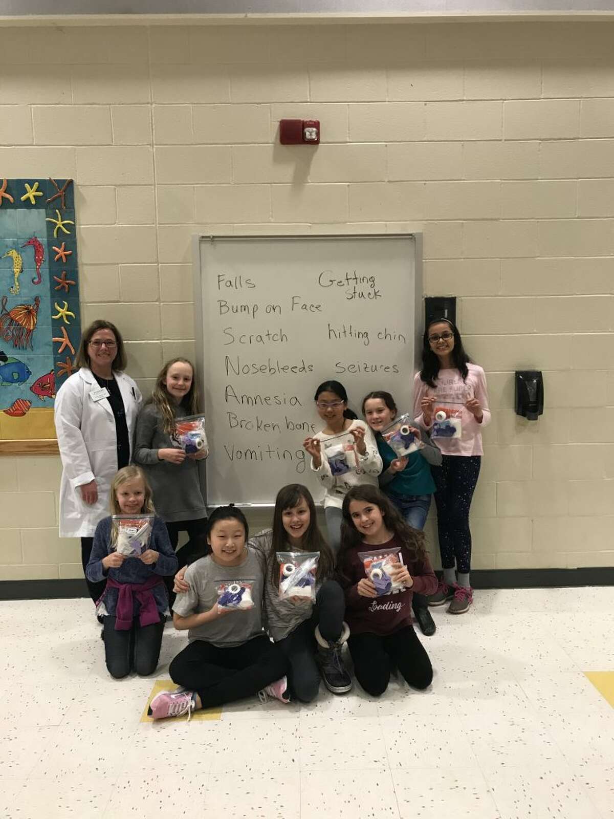 Pictured, from left to right: Dr. Lynne Savino, Camryn Art, Charlotte Fandrick, Stella Yi, Maura McGuire, Sophie Heitner, Cece Gu, Zella Bunch, and Aayushi Dabi. Not shown: Ashley Zettl and Emily Honore.