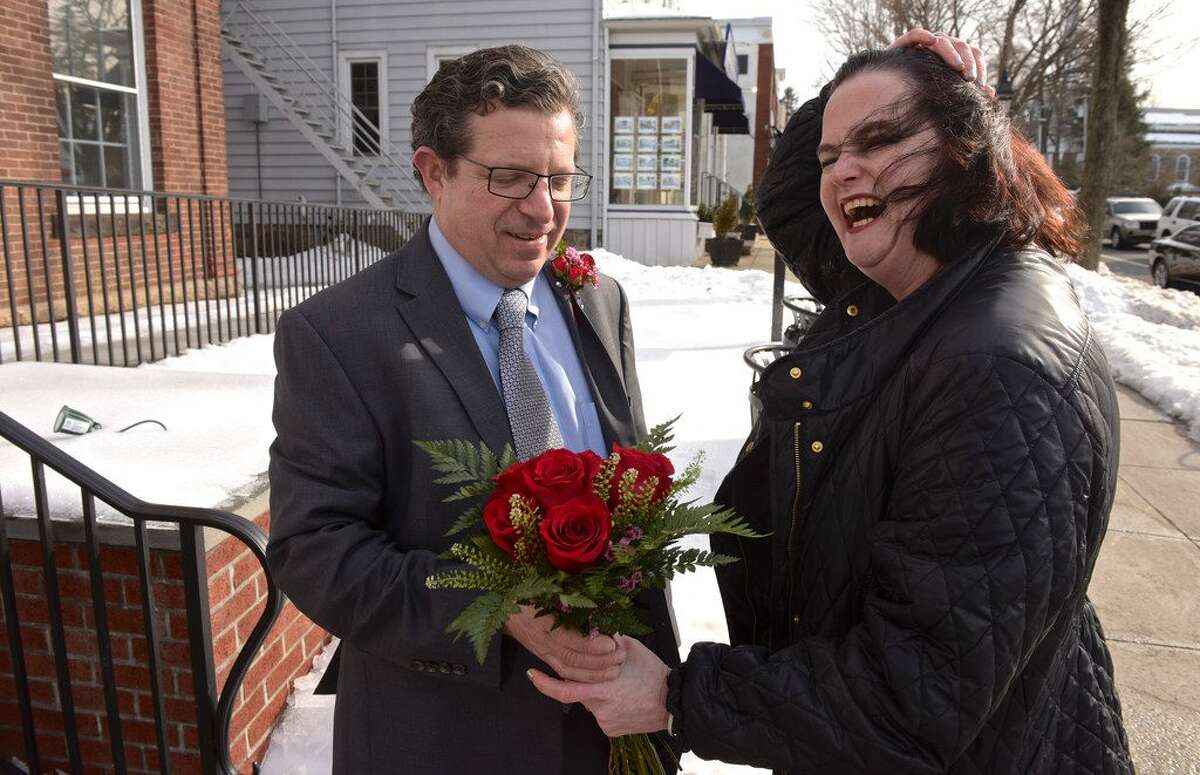 Sara and John Lowenstine, of Ridgefield, renewed their wedding vows on the fifth anniversary of their Valentine's Day wedding with the help of Justice of the Peace Mark Robinson, in Ridgefield Town Hall, Ridgefield, Conn, on Thursday, February 14, 2019. — H. John Voorhees