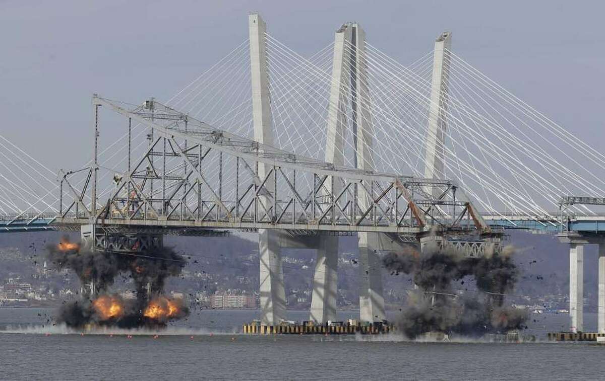 A section of the old Tappan Zee Bridge is brought down with explosives in this view from Tarrytown, N.Y., Tuesday, Jan. 15. The blast was reportedly heard on Silver Spring Road. — Seth Wenig, AP