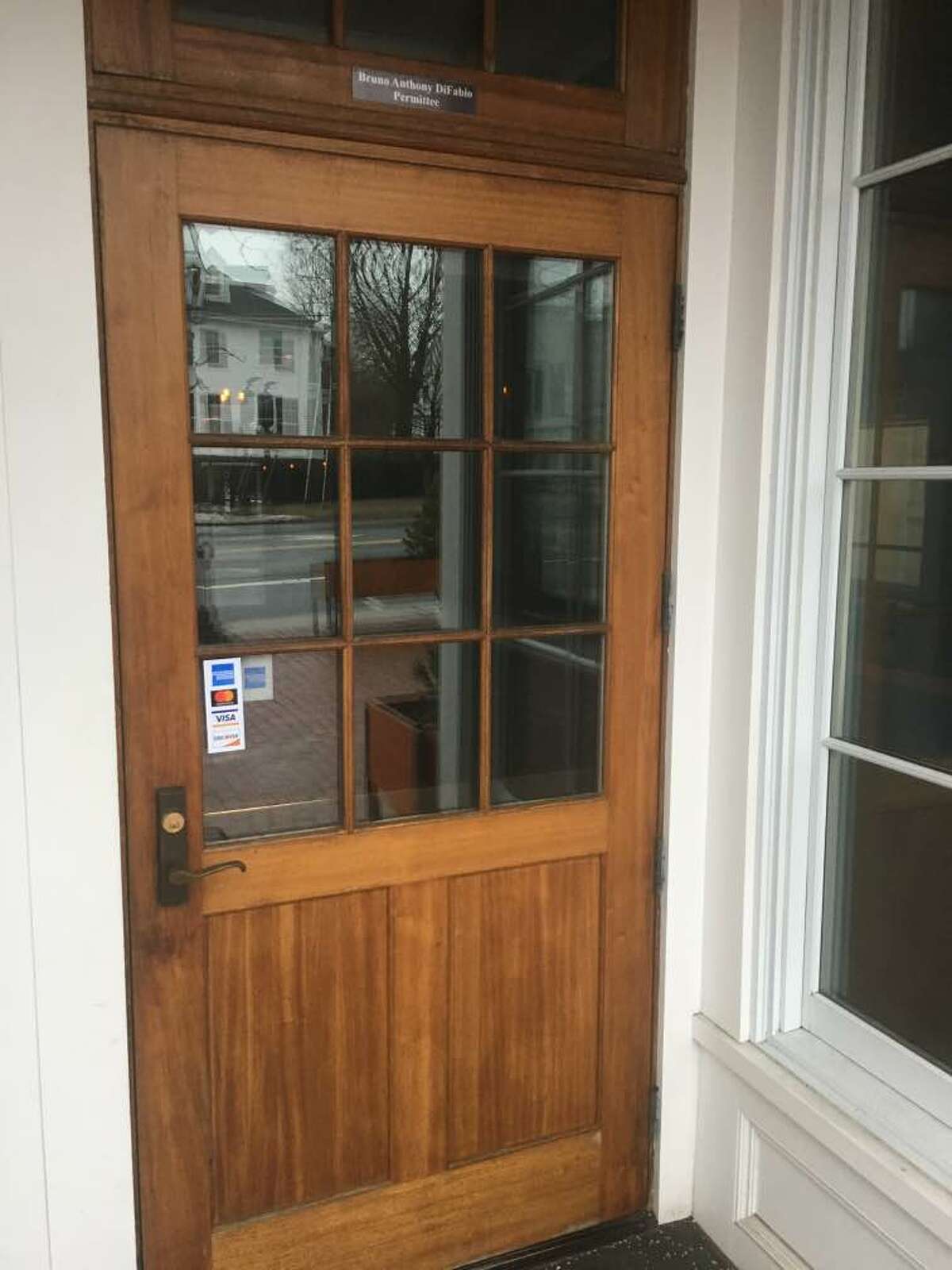 The front door of The Village Tavern doesn't have a closing sign but the owner has announced the business will be sold. It will be closed for the foreseeable future.