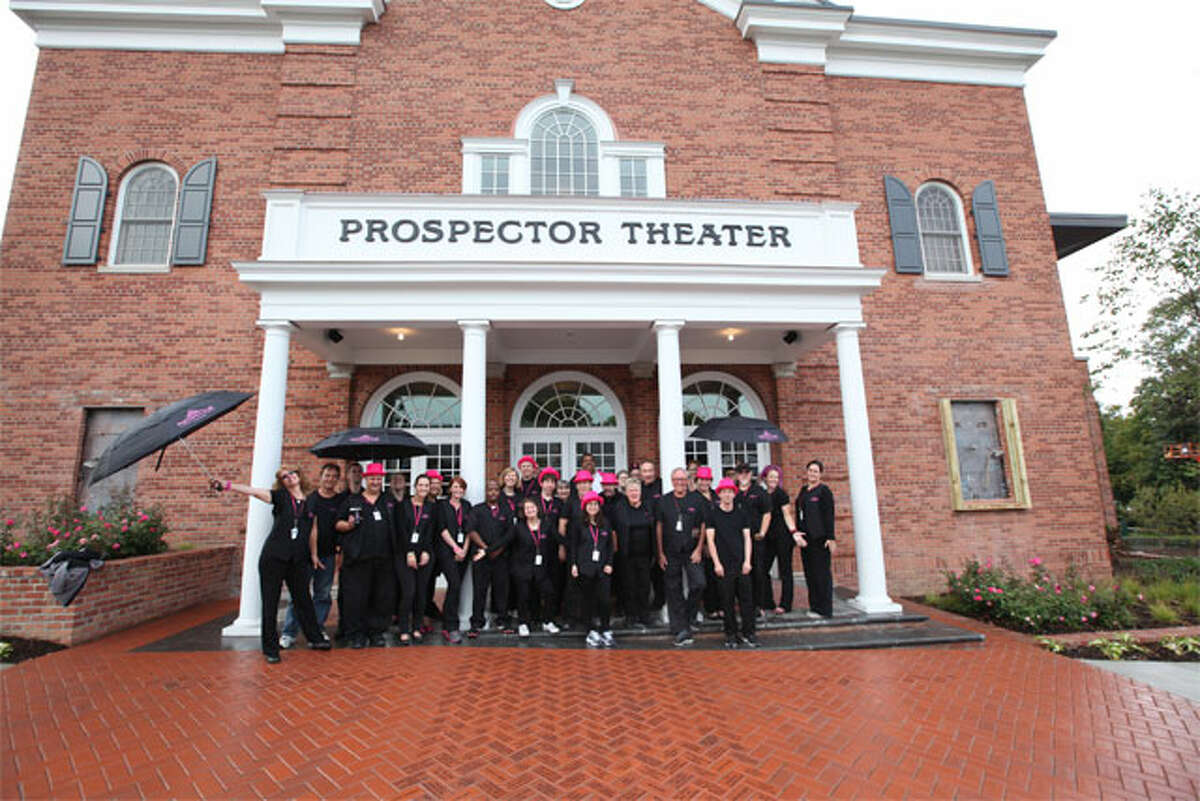 The Prospector Team pose in front of Ridgefield's moviehouse before the theater's grand opening in 2014.