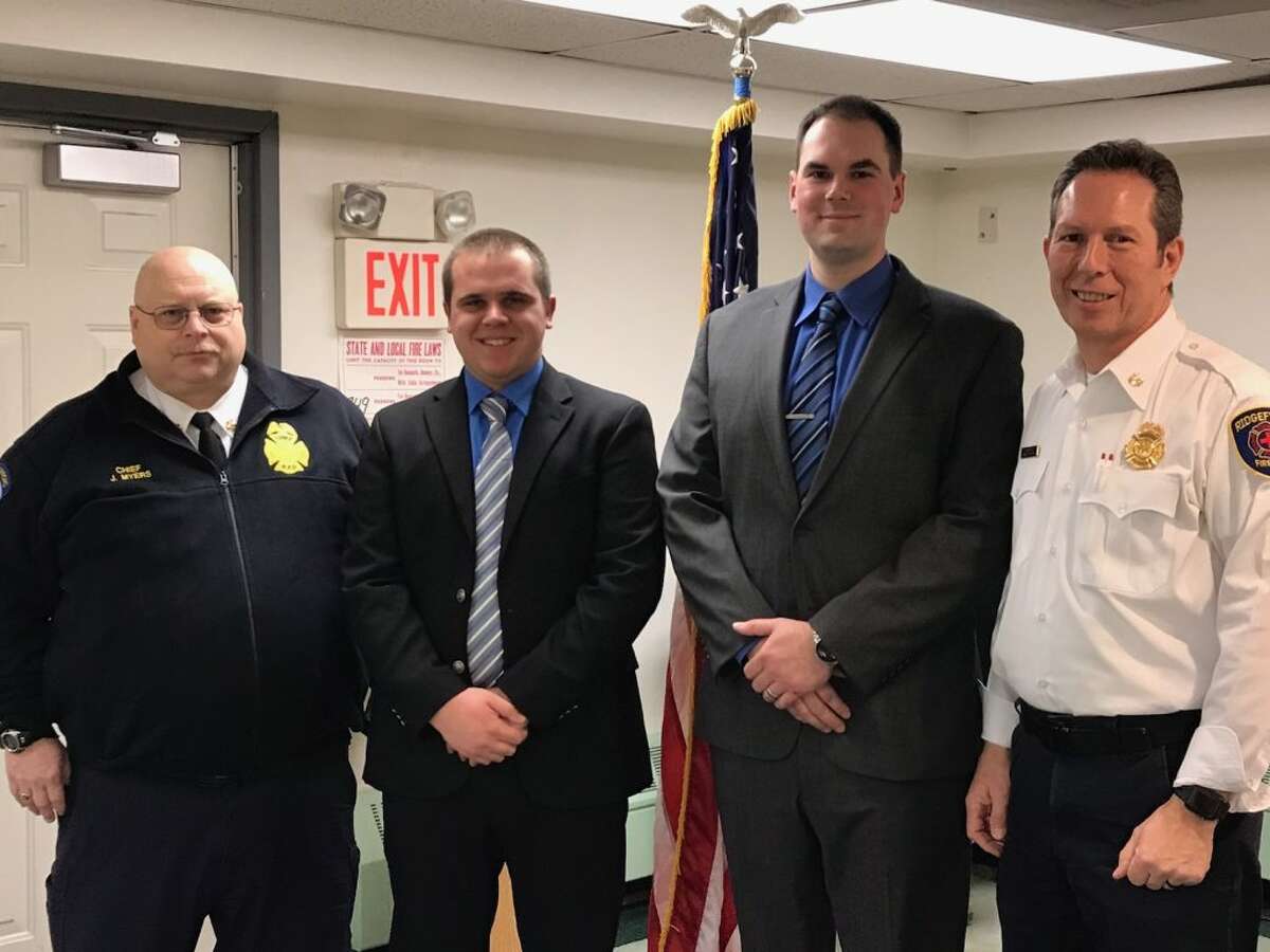 Ridgefield Fire Chief Jerry Myers, far left, and Assistant Fire Chief Mickey Grasso, far right, stands with the department’s new hires, Seth Kellogg and Ryan Underwood.