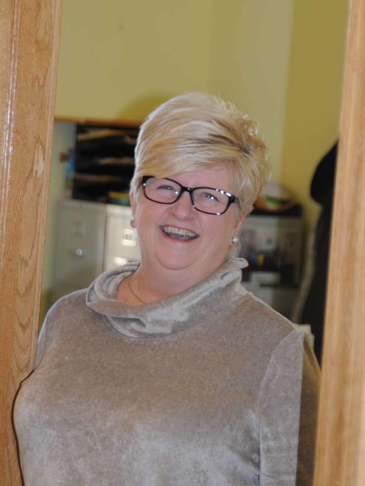 Karen Gaudian, the town's employee of the year, serves a variety of people working in the social services office. - Macklin Reid photo
