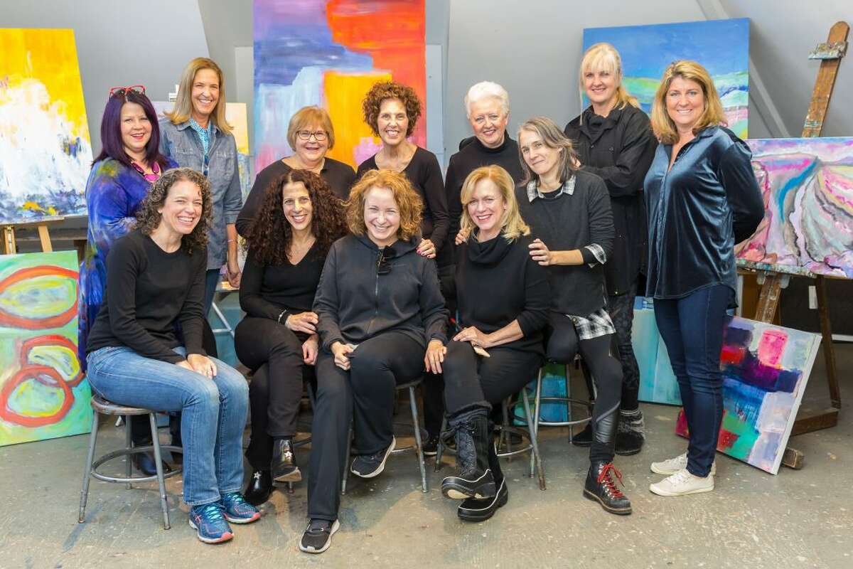 Abstract painters who are displaying their work at Sarah’s Wine Bar through March 10 include, back row from left: Rhonda Gentry, Madyn Gwynn, Karen Beck, Kathleen Wrampe, Ruth van den Nieuwenhuizen and Jacque Lang. Front row from left: Dayna Sierakowski, Blair Crowley, Rachel Volpone (instructor), Tina Sturges, Michelle Briody. — Mary Harold photo