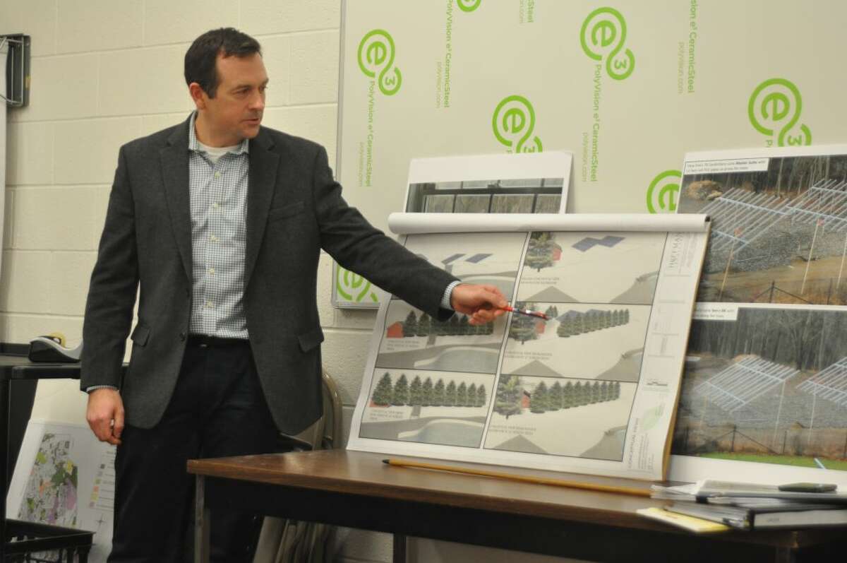 Landscape architect Brian Cossari of Hoffman Landscapes showed the Zoning Board of Appeals hearing how the disputed solar arrays might be screened with a row of evergreens. — Macklin Reid photo