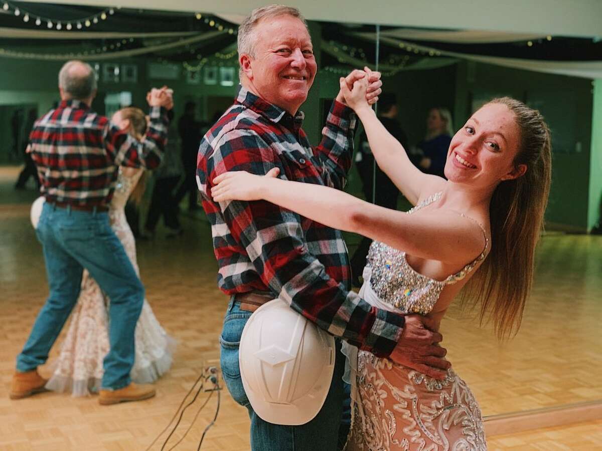 Dance instructor Samantha Lovetere, above, teaches Ridgefield resident Kent Rohrer, board chair at Housatonic Habitat for Humanity, how to salsa.