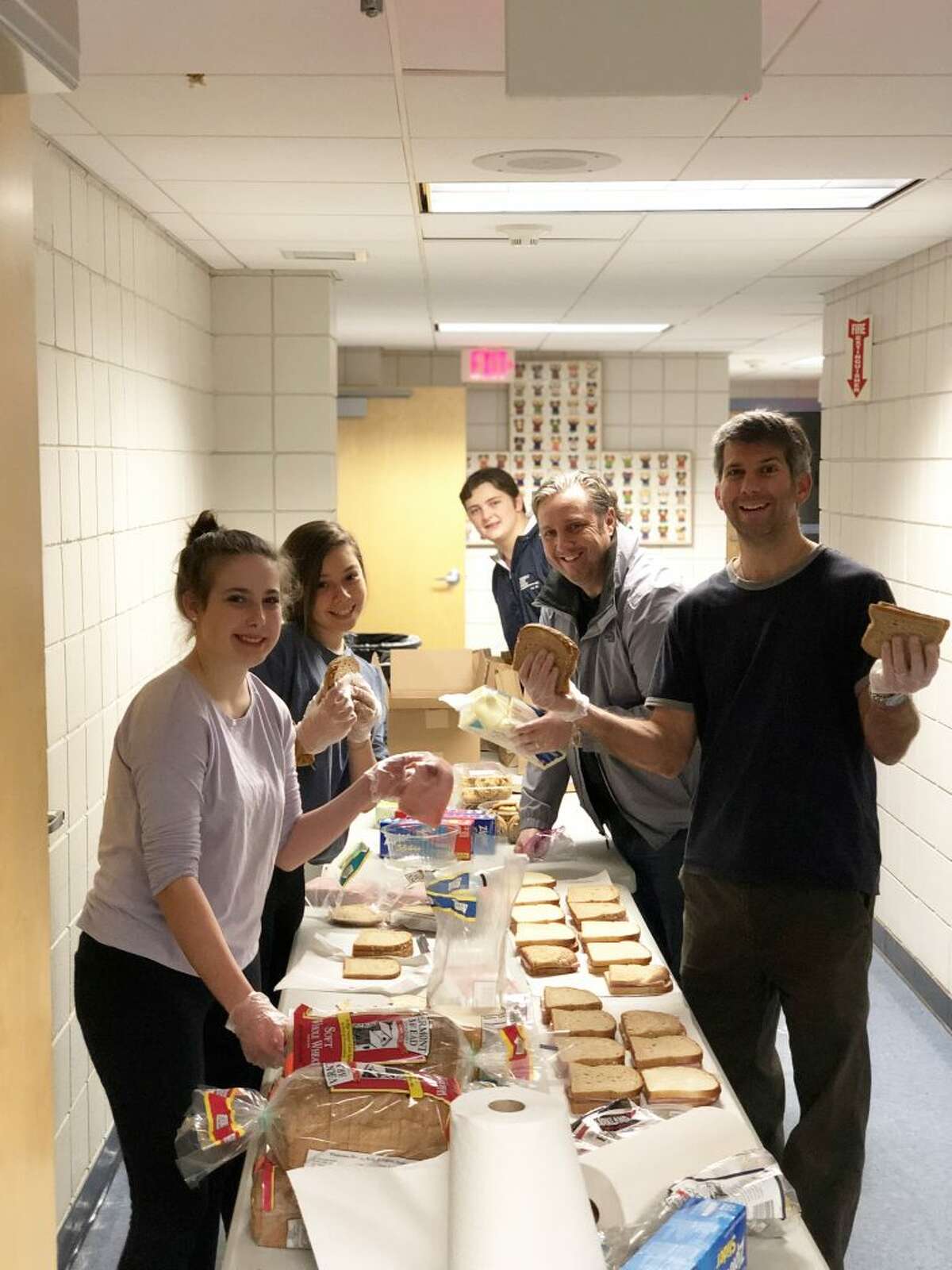 Project Heart Ridgefield members prepare sandwiches at St. Mary Church Friday, Dec. 21, before making a trip to New York City to help the homeless.