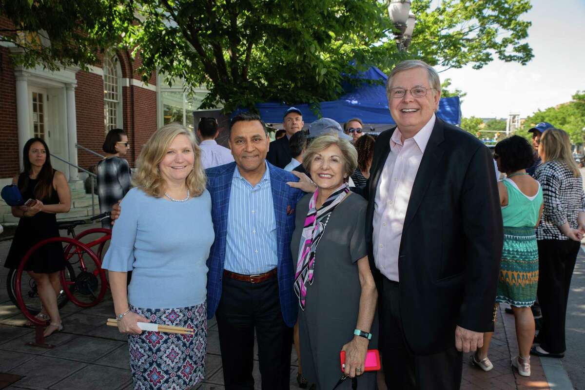 HARMAN CFO Sandy Rowland, HARMAN CEO Dinesh Paliwal, Stamford Downtown Special Services District President Sandy Goldstein and Stamford Mayor David Martin celebrate Make Music Day at the HARMAN Street Studio in downtown Stamford in 2018.