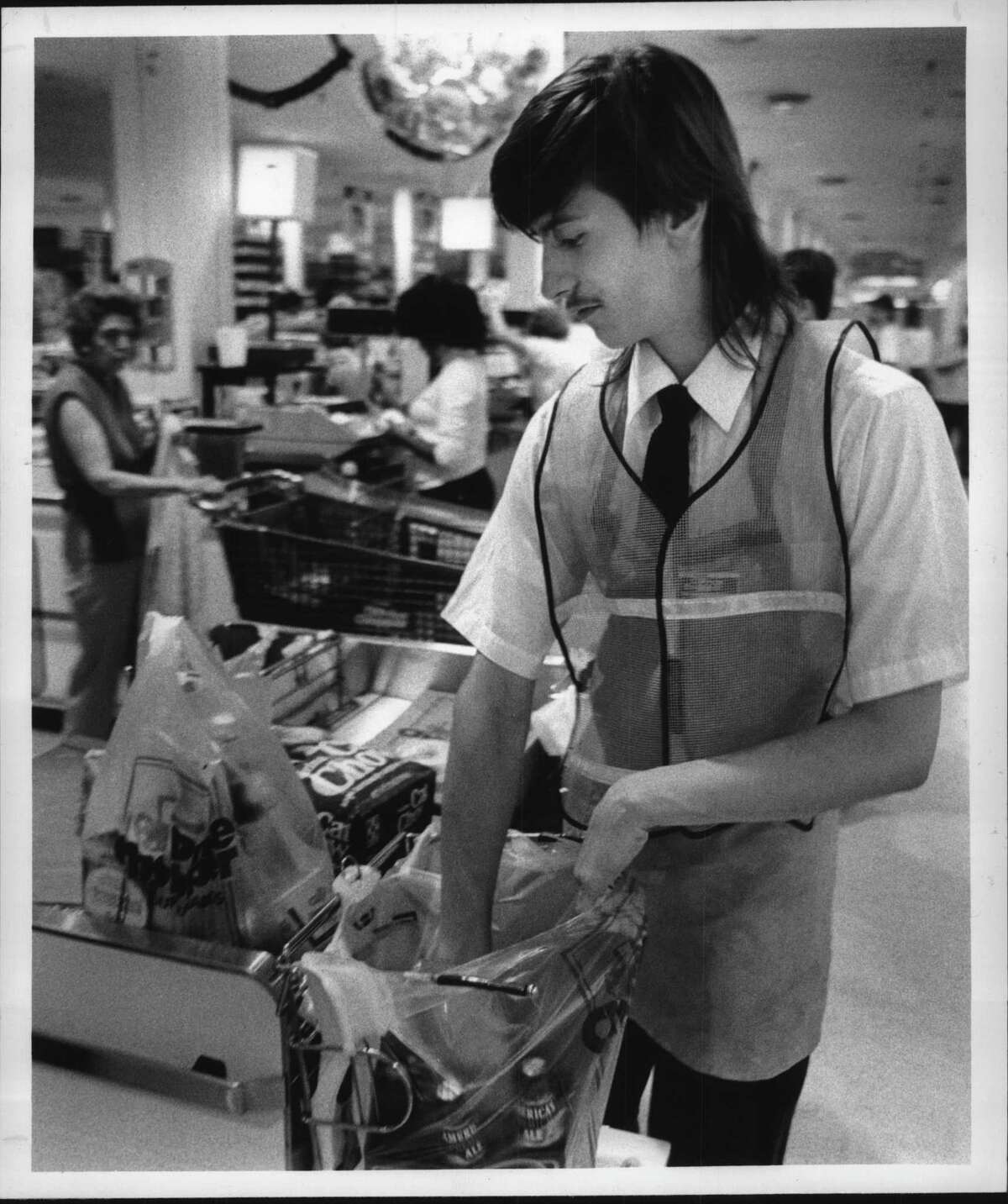 Price Chopper, Eastern Parkway, Schenectady, New York - Paul LeViker, 15, of Schenectady, packs groceries Friday afternoon as part of stay in school program. June 23, 1989 (John Carl D'Annibale/Times Union Archive)