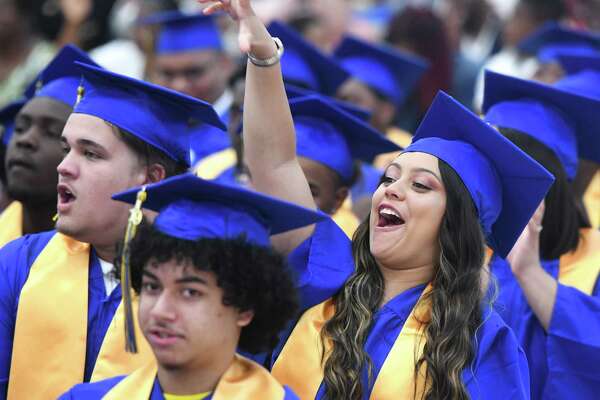 Graduating senior Damarys Seda cheers during the 93rd Annual Commencement at Warren Harding High School in Bridgeport, Conn. Tuesday, June 18, 2019. The Class of 2019 was the first to graduate from the new Warren G. Harding High School on the long-awaited Bond Street location.