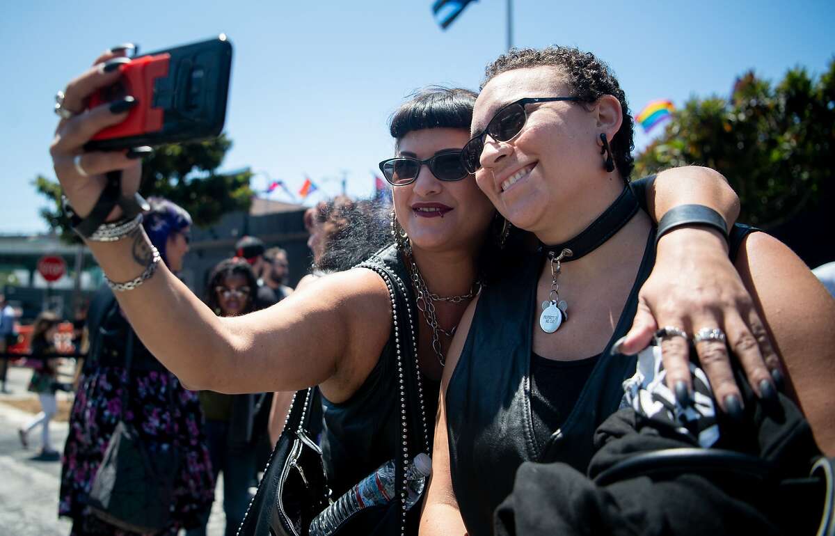 Attendees pose for a photo at the groundbreaking of the world?•s first public plaza dedicated to the living commemoration of Leather Heritage at the SF Eagle Bar in San Francisco on Tuesday, June 18, 2019.