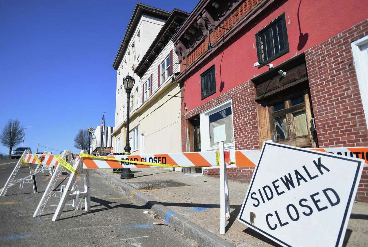 The sidewalk is closed in front of 195 Main St. in Derby March 19, 2019, as demolition work in the area takes place.