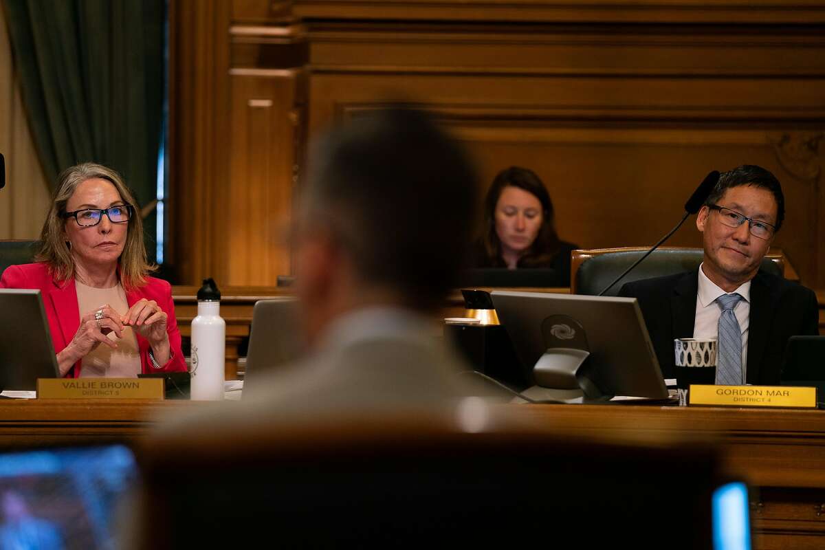 Supervisors Vallie Brown (left) and Gordon Mar (right), listen as Ahsha Safa’ (center) speaks about legislation that would ban the sale of e-cigarettes at City Hall in San Francisco, Calif., on Tuesday, June 18, 2019.