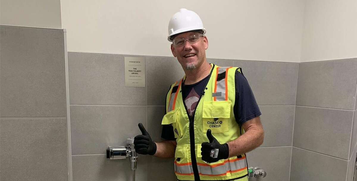 Tom Tolbert stands with the urinal honoring him at the Chase Center. Click through the gallery for a look at the greatest Warriors memories and moments in Oakland, before moving to the Chase Center.