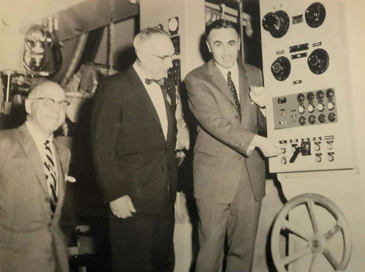 Governor Abraham Ribicoff pushes the button to officially start operations at the new Kimberly-Clark mill on Pickett District Road in New Milford April 21, 1958. To his right is then-First Selectman E. Paul Martin. Joining them is William Kellett, president of the Kimberly-Clark Corp. If you have a