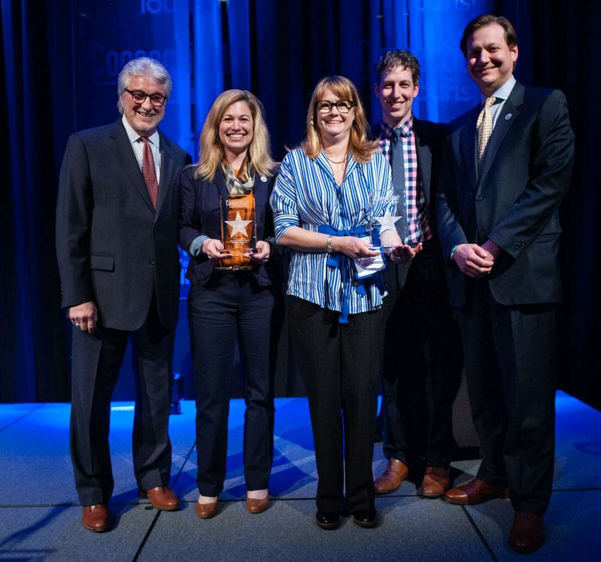 Hilary Criollo, owner of Hopkins Vineyard in Warren, second from right, and Rebecca Eddy, agriculture marketing and inspection representative with Connecticut Farm Wine Development Council, second from left, recently each received the 2019 Connecticut Tourism Award for Tourism Partners of the Year. The awards were presented at the annual Connecticut Conference on Tourism May 8, 2019. Criollo is vice president of the Connecticut Vineyard and Winery Association. Eddy has led the marketing for the Connecticut Farm Wine Development Council's popular