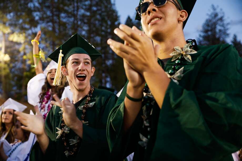 Paradise High School senior Lance Lighthall,17 (left) cheers during his high school graduation ceremony in Paradise, California, on Thursday, June 6, 2019. Lance's home was destroyed in the Camp Fire that decimated Paradise midway through his senior year. His family of nine could not afford to stay in the Chico area and were forced to move to Modesto. Lance plans to attend BYU-Idaho in the Fall. Photo: Gabrielle Lurie / The Chronicle
