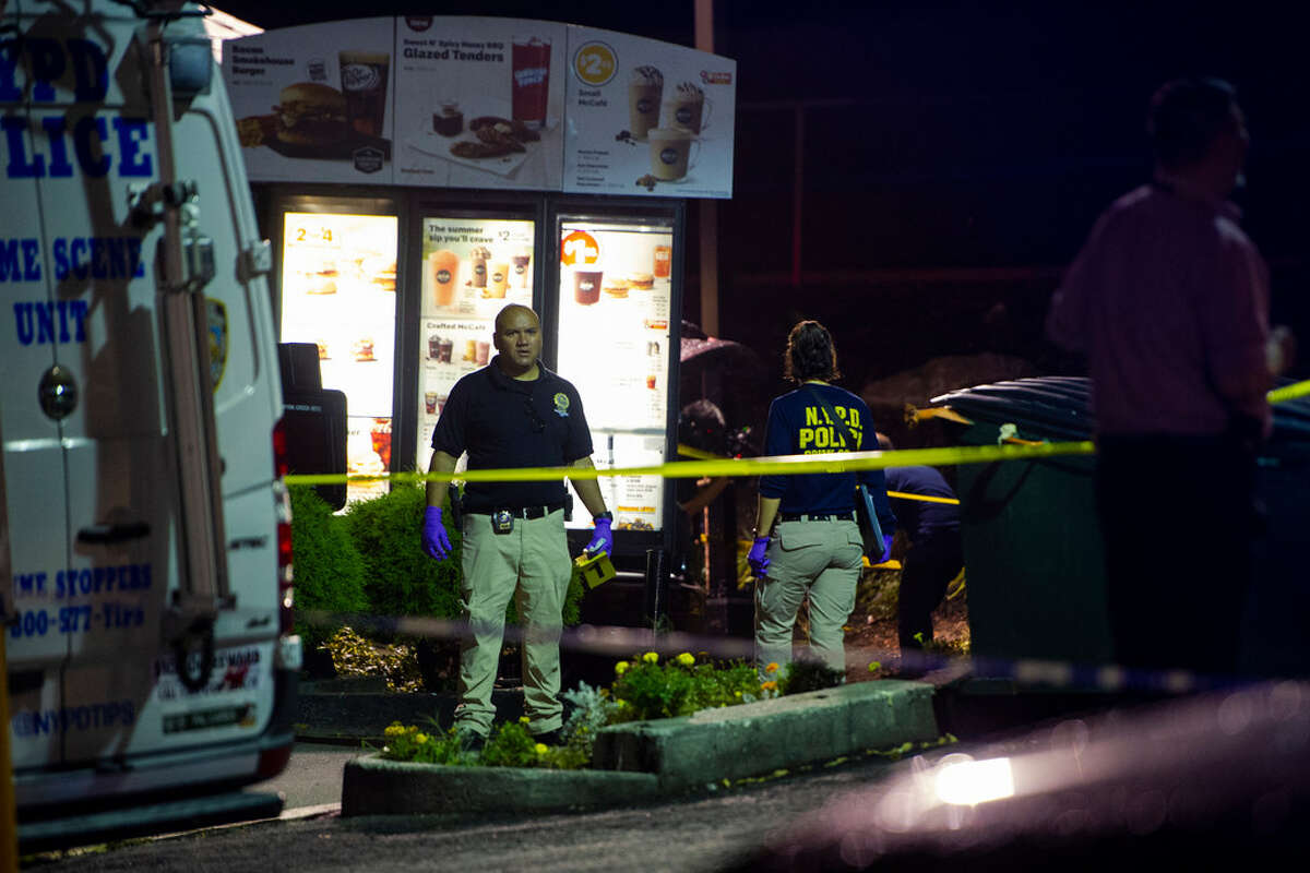 FILE -- Police investigate a drive-thru where mobster Sylvestre Zottola was assassinated, in the Bronx, Oct. 4, 2018. The mastermind of the killing, federal prosecutors now say, was actually a member of a family even closer to Zottola — his own son.