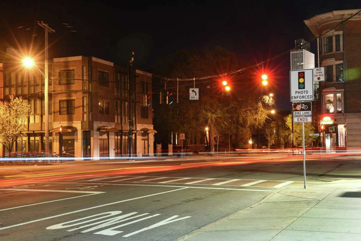 Cars pass through the intersection at Madison Avenue, Lark Street and Delaware Avenue in this long exposure photograph of the red light camera intersection. (Lori Van Buren/Times Union)