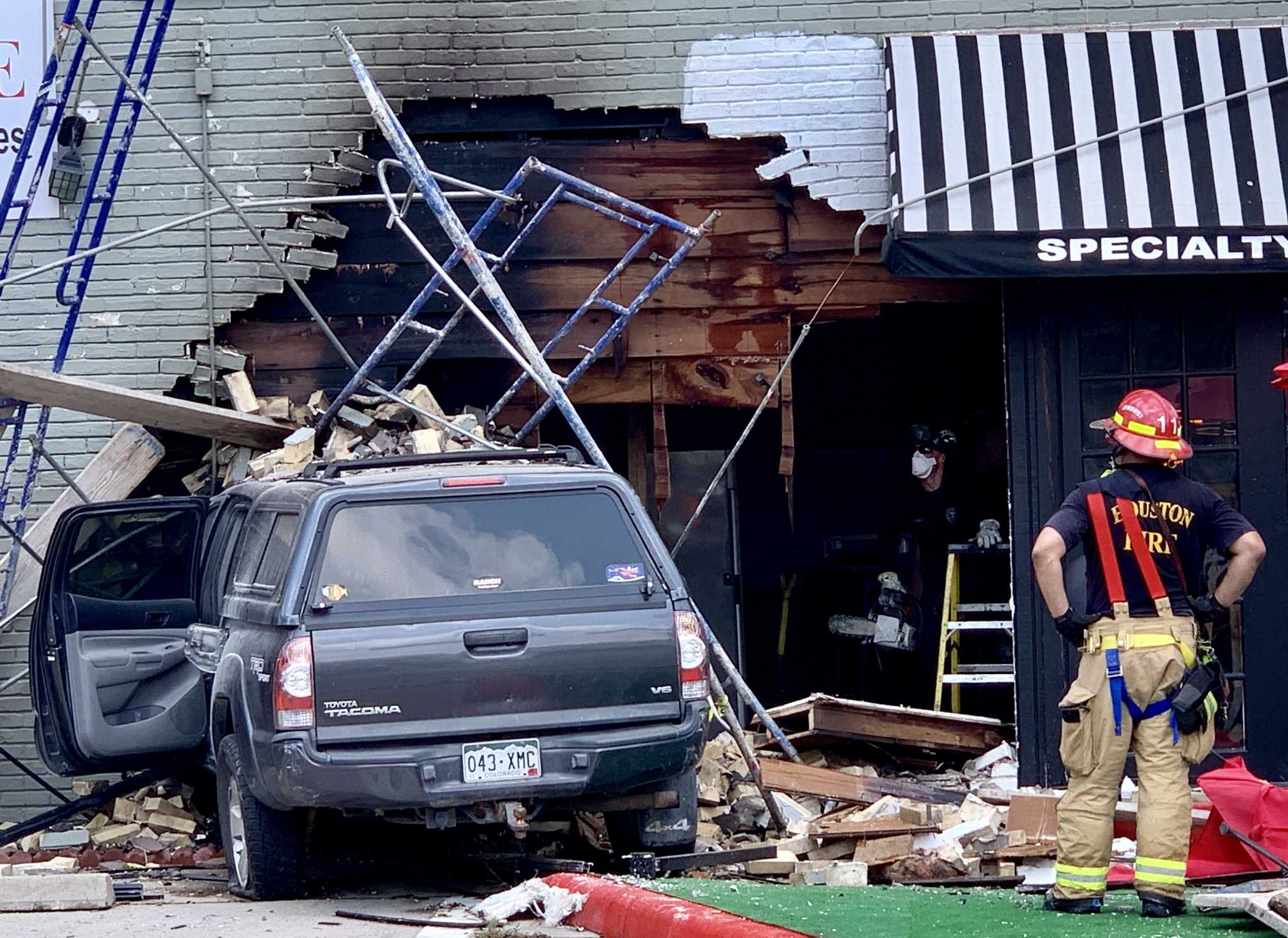 Pickup truck slams into Heights restaurant, catches fire