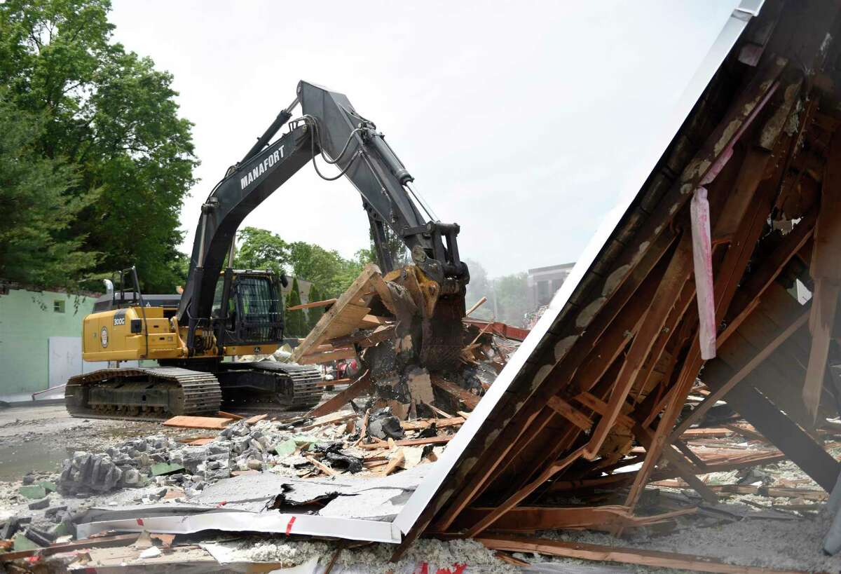 A construction crew begins demolition of the former Pet Pantry building in Greenwich, Conn. Wednesday, June 12, 2019. The Town of Greenwich will begin construction on a new substation and line project at the site that will improve electric reliability within the town.