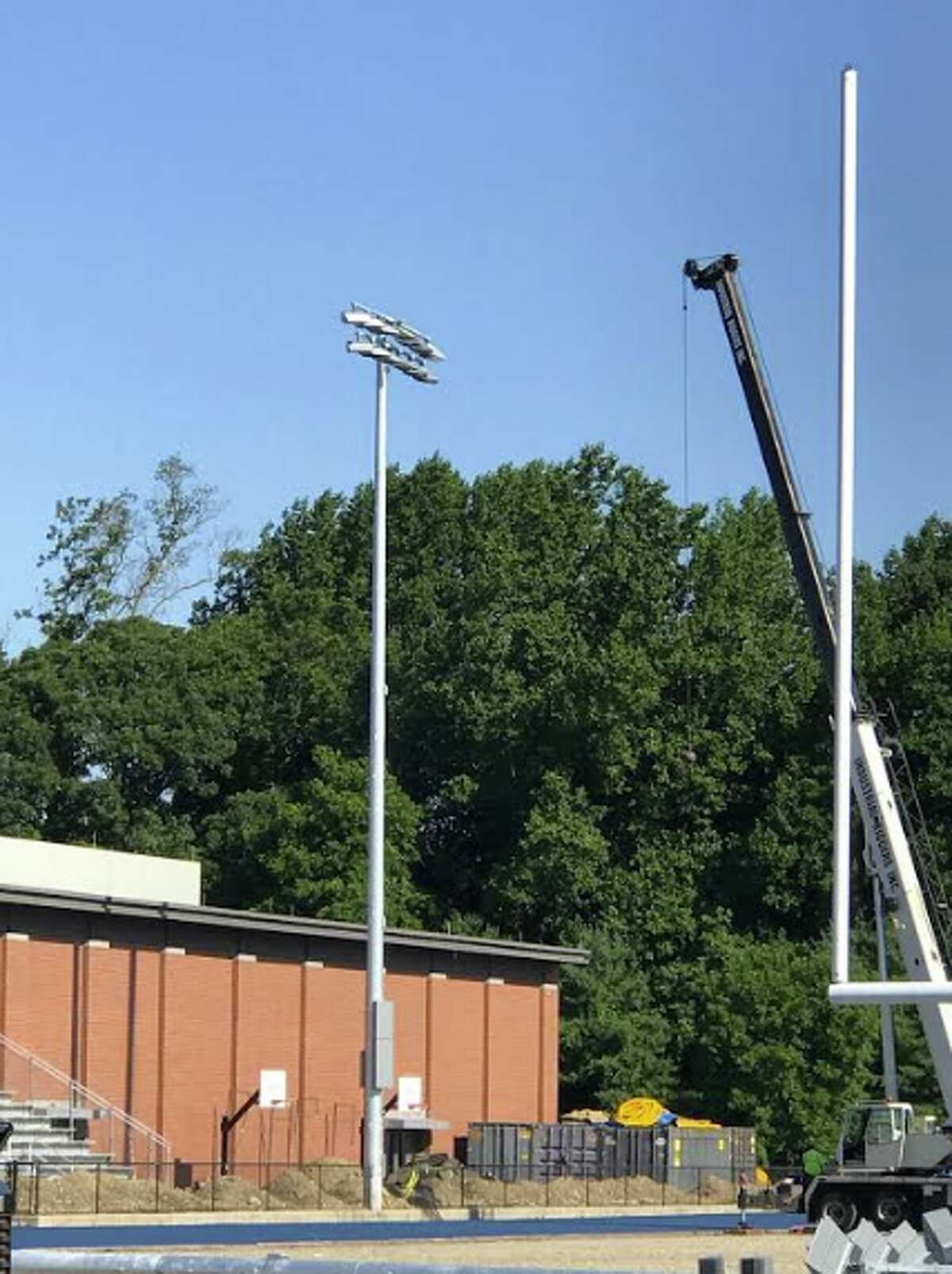 First light — Darien High School light pole installation has begun