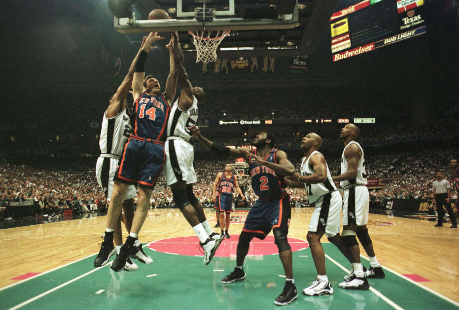 Tim Duncan of the San Antonio Spurs walks upcourt during the game