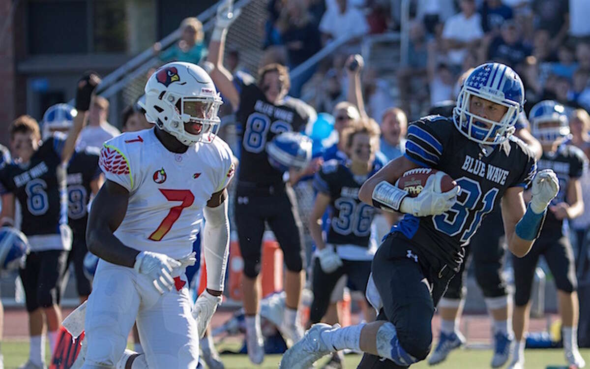 Tim Herget completing the toss of the game from Brian Peters to score on the play of the game against Greenwich at Darien last season. Courtesy Darien Athletic Foundation