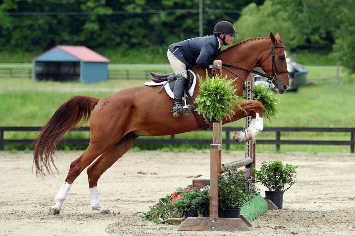 Justin Meyers rides Apollonios during the Skidmore College Saratoga Classic on Wednesday, June 19, 2019 at White Hollow Farm in Stillwater, NY. (Phoebe Sheehan/Times Union)
