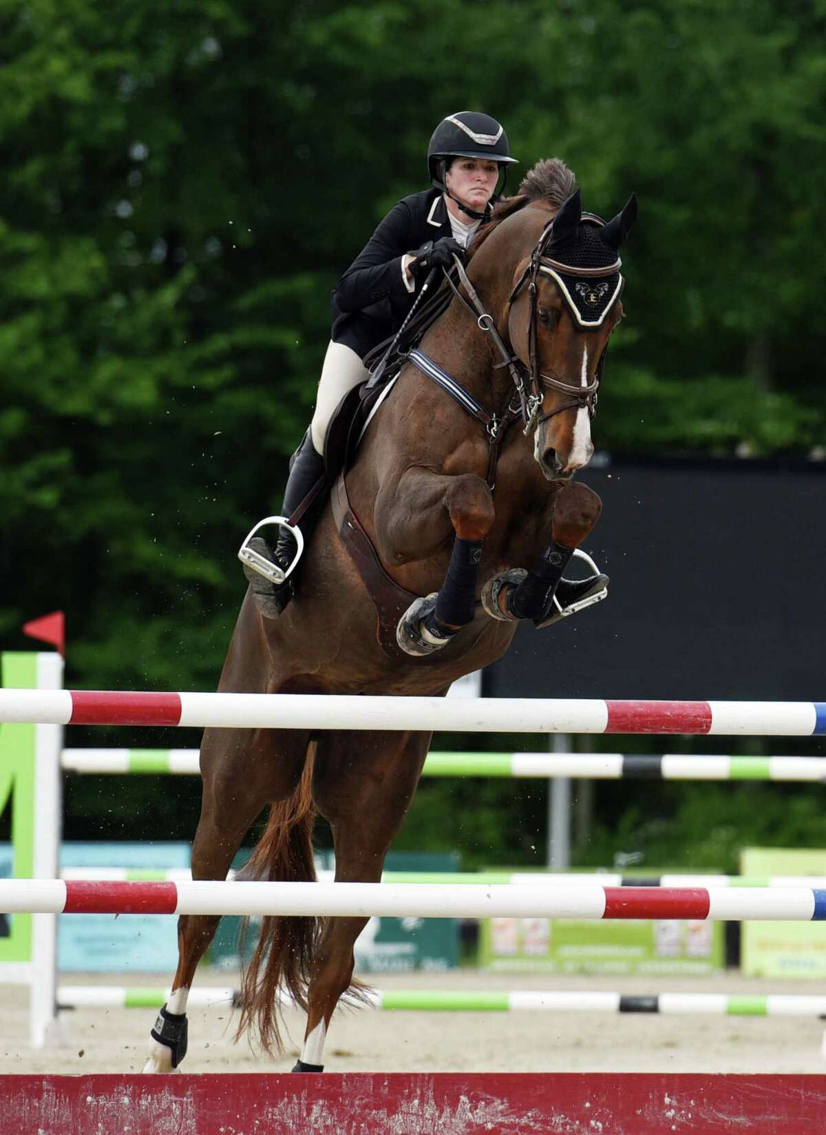 Megan Bash clears a jump with horse, Silver Spring, during the Skidmore College Saratoga Classic on Wednesday, June 19, 2019 at White Hollow Farm in Stillwater, NY. (Phoebe Sheehan/Times Union)