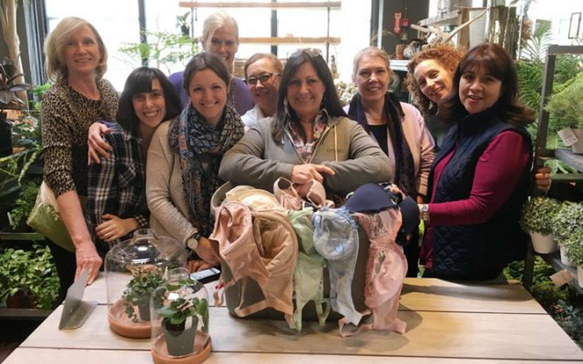 Volunteers at Neighbor to Neighbor, Greenwich, sort donations of bras received from Mardi "Bra" 2017.