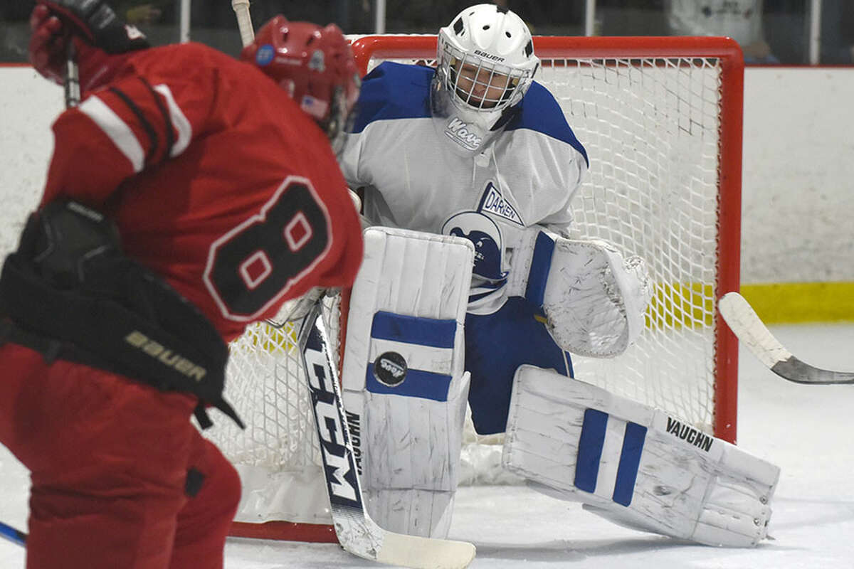 Darien goalie Henri Pfeifle squares up the puck during a Wave contest against Greenwich last winter. - Dave Stewart photo