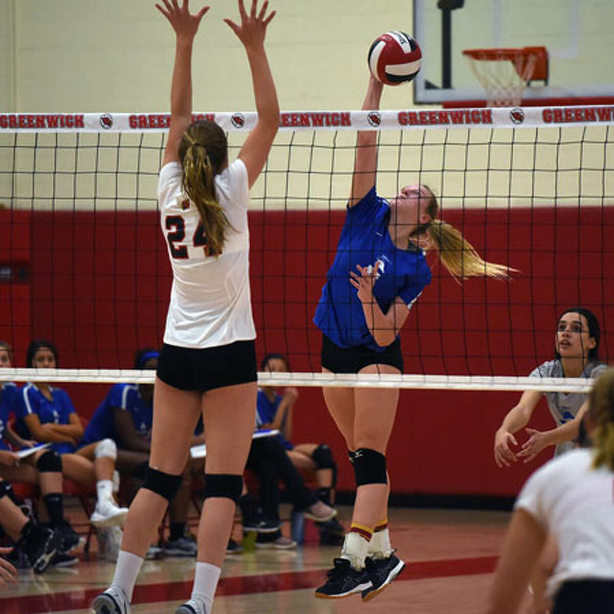 Darien senior co-captain Lindsay Bennett puts down a point during the Wave's 3-0 win over Greenwich in the FCIAC quarterfinals on Tuesday. - Dave Stewart photo