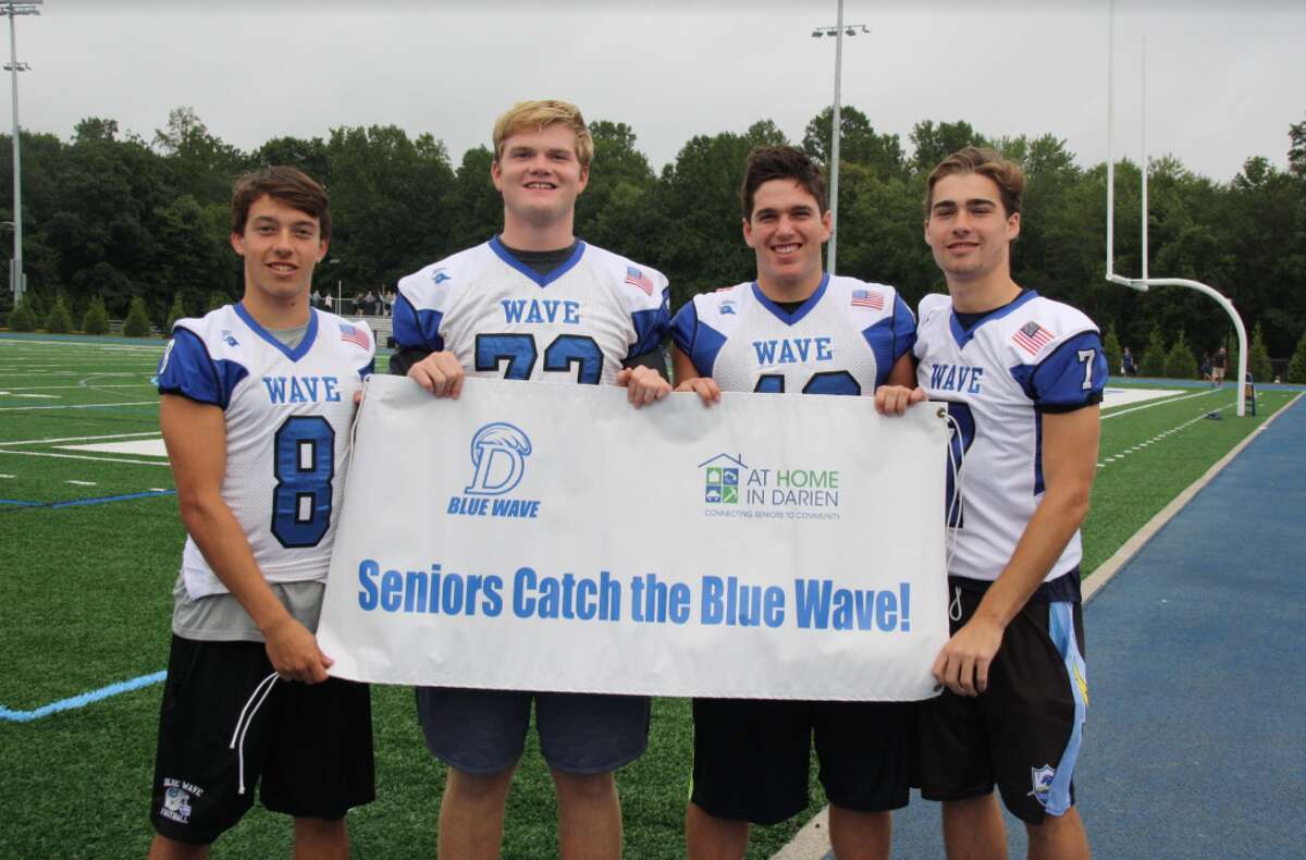 The 2018 Darien High School Football Captains extend an invitation to seniors to attend home games. Blake Cellar, left, Willy Keating, Connor Fay and Bruce Ferguson.