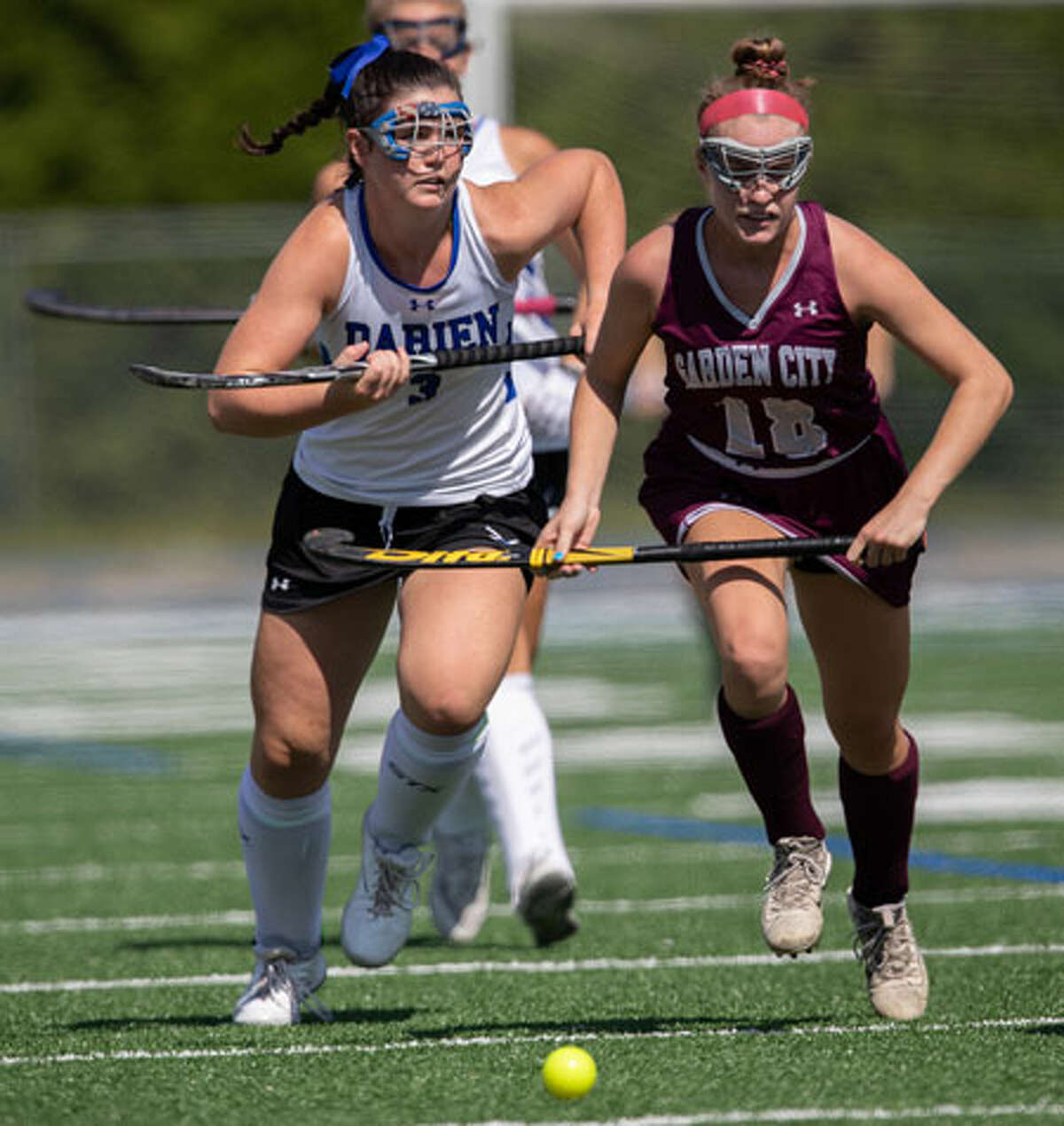 Catie Duggan races up field during the Blue Wave's field hockey game against Garden City on Saturday. - Darien Athletic Foundation photo