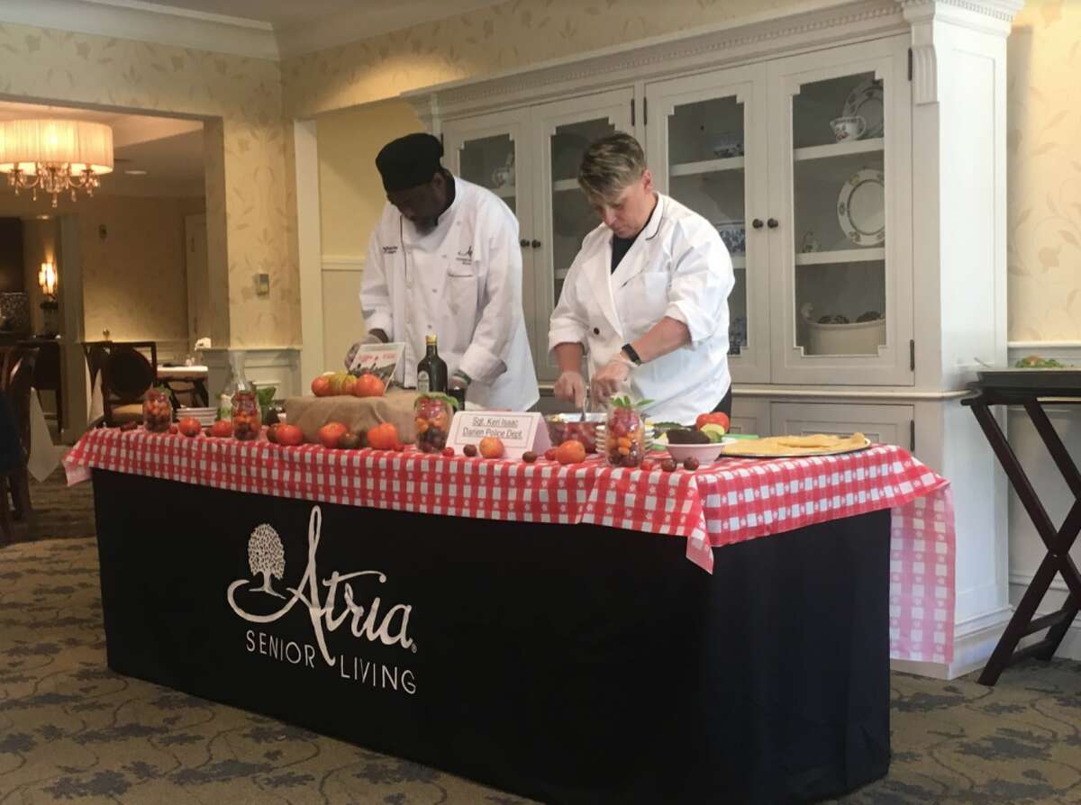 Director of Culinary Services at Atria Darien Carrington Parker, left, recently challenged Darien Police Sgt. Keri Isaac to a cooking competition as part of Atria Senior Living's annual Chef Showdown