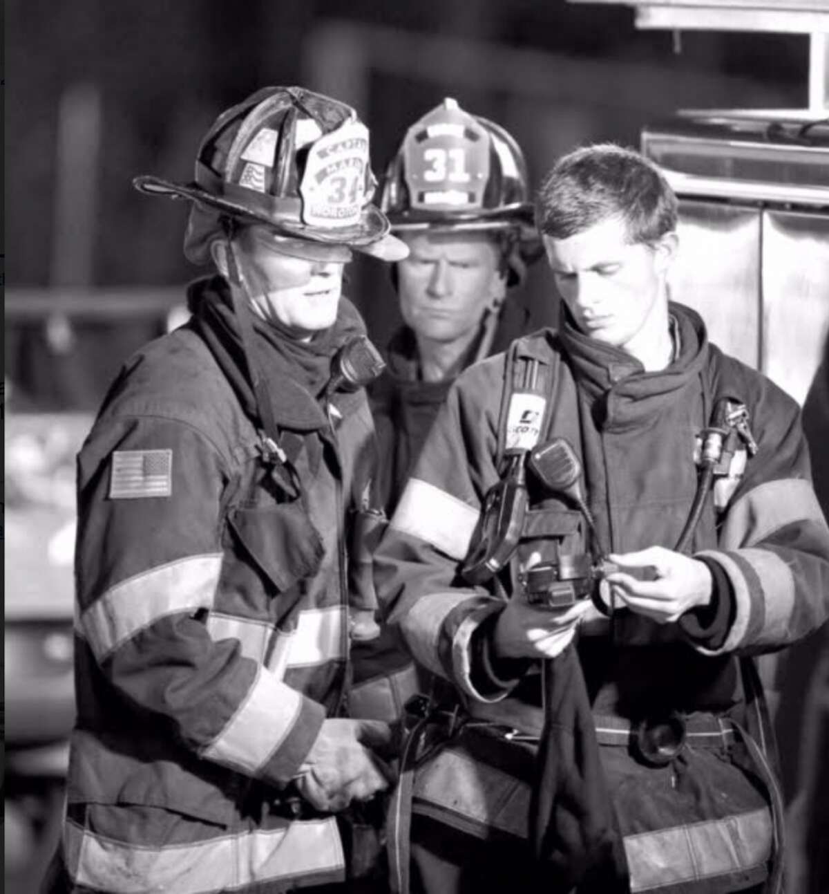 Noroton Fire Captain Jack Butcher, Firefighters Dave Woll and his son, Ted Woll.