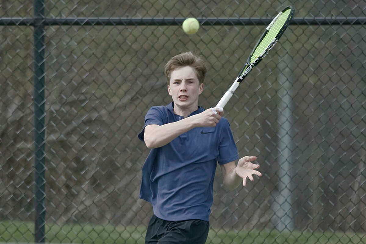 Darien's Nick Derby returns a shot during a Blue Wave victory last spring. Derby, a junior who played at No. 2 singles last year, returns as a key player in the Wave's singles lineup this season. - Scott Mullin photo