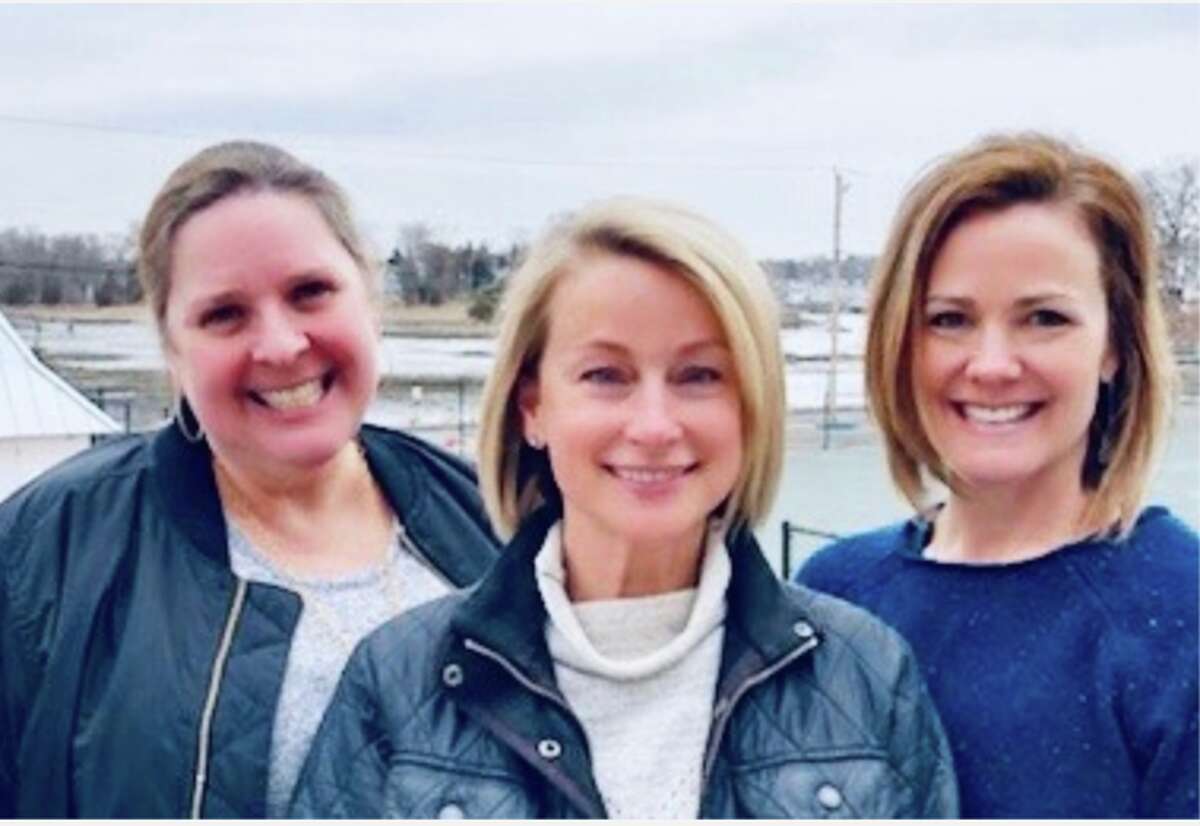 Spring into Fashion graphic designer Kathryn Doran and event co-chairmen Elisa Persinger & Casey McBride