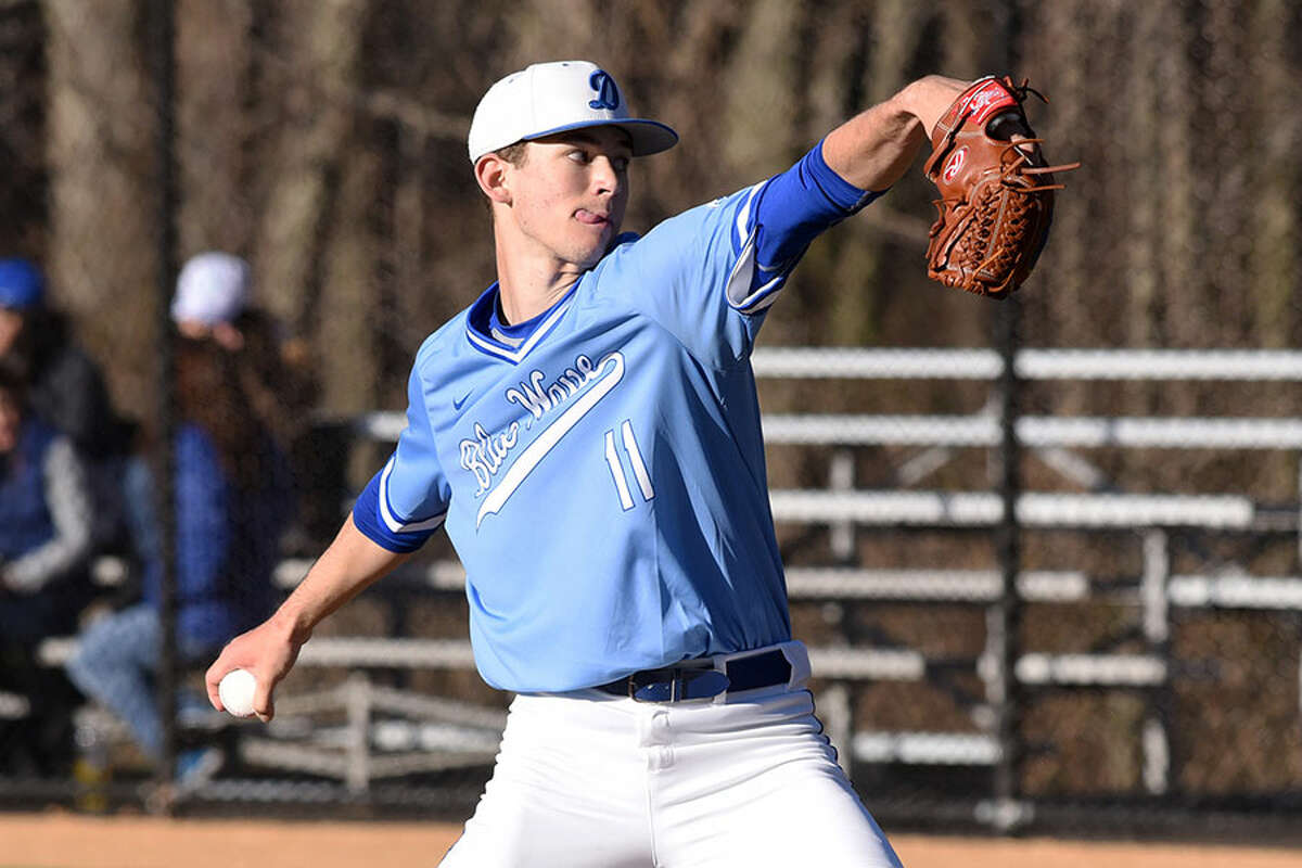 Darien's Henry Williams throws a pitch during the Blue Wave's baseball game against the Trumbull Eagles at Darien High School on Wednesday, April 10. - Dave Stewart/Hearst Connecticut Media