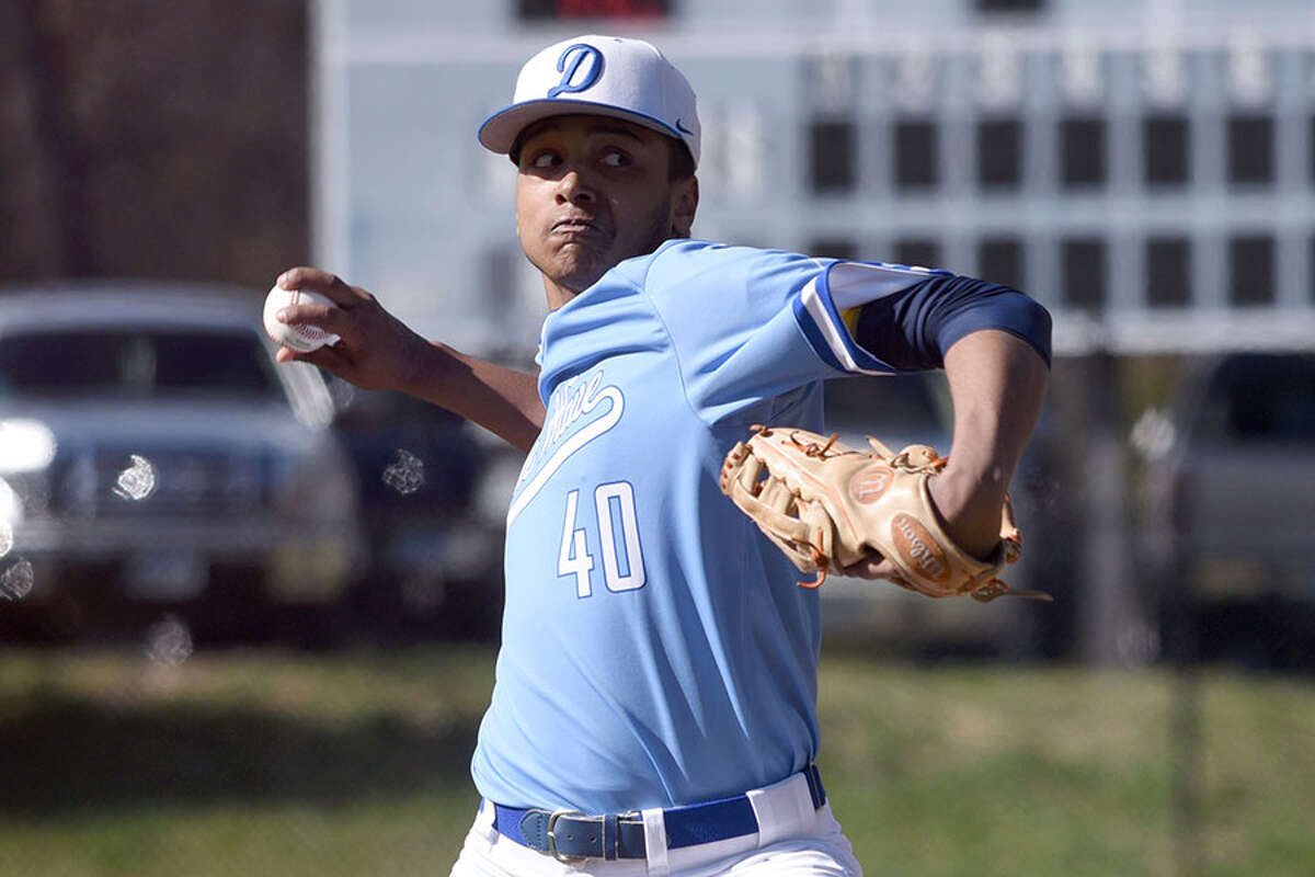 Darien’s James Louis fires in a pitch during the Blue Wave’s baseball game with Trumbull at Darien High School on Wednesday. — Dave Stewart/Hearst Connecticut Media