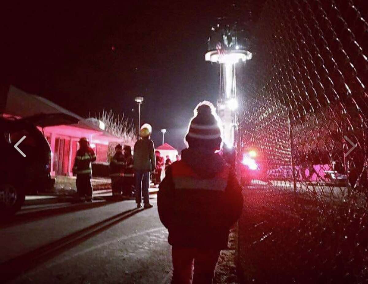 Four-year-old Darien resident Hunter looks on as the Darien Fire Department trains at the senior housing complex in Darien. - Darien Fire Department/Facebook
