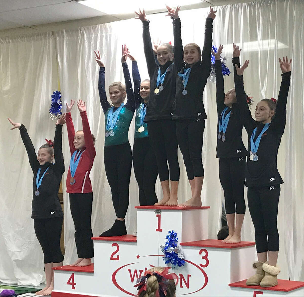 Darien YMCA Level 7 gymnasts Anna Primmer and Julia Decsi tied for first on beam while Lauren Smith placed sixth, Kristie Alianiello fifth and Sofia Alarcon-Frias third at the Snowflake Invitational meet in Wilton.