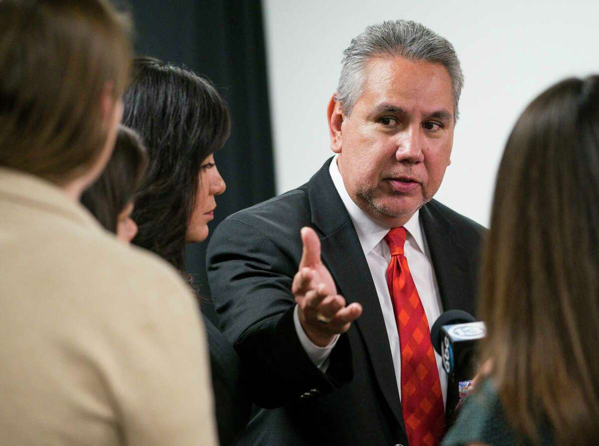 In this March file photo, Houston ISD Trustee Sergio Lira talks with reporters regarding the news Monday that the Texas Education Agency's state-appointed conservator ordered the board to suspend their search for a permanent superintendent. Lira faces challenger Dani Hernandez in the Nov. 5 election.