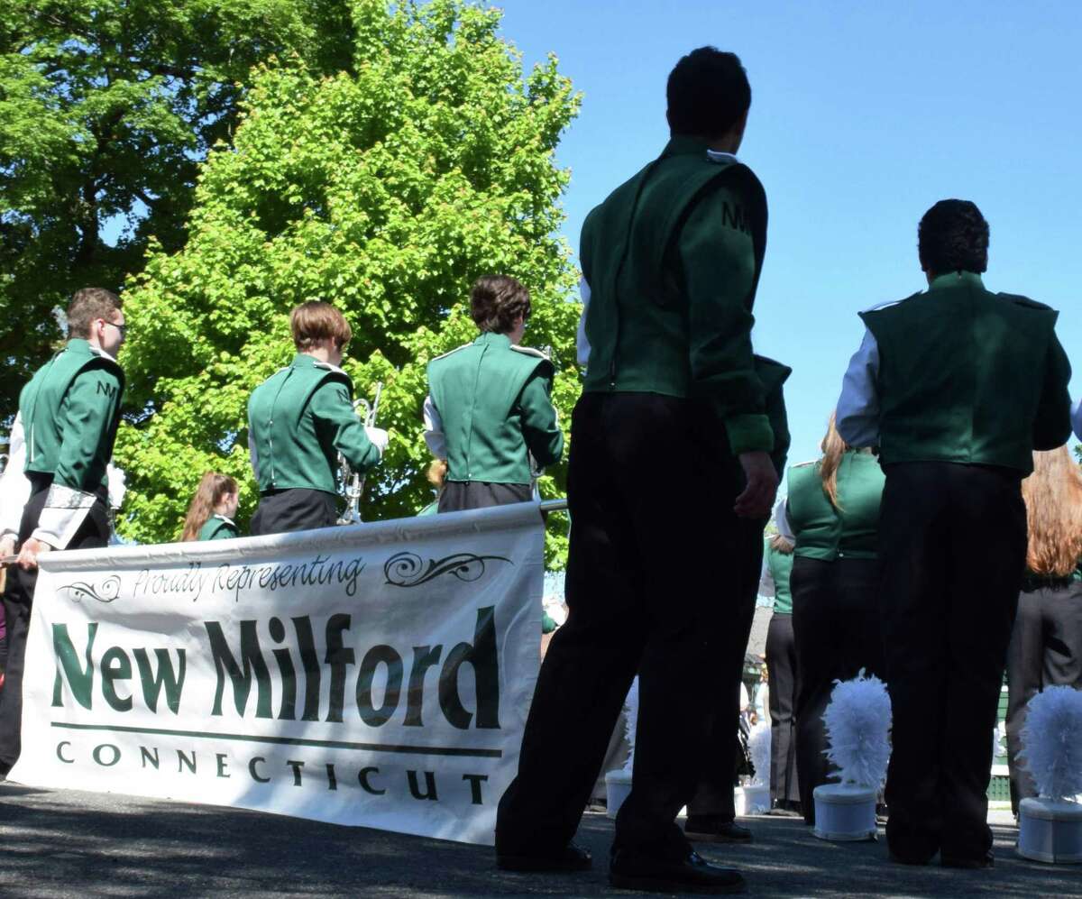 File photo of the New Milford High School Marching Band. May 27, 2019. Above, members of the New Milford High School band wait for directions from their drum majors.