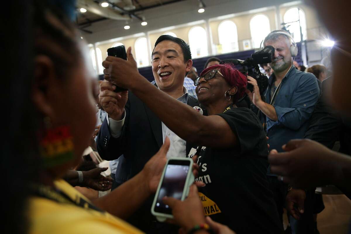 WASHINGTON, DC - JUNE 17: Democratic U.S. presidential hopeful Andrew Yang poses for selfies with attendees during the Moral Action Congress of the Poor People's Campaign June 17, 2019 at Trinity Washington University in Washington, DC. The Campaign held the event to focus on issues like voting rights, health care, housing, equitable education, indigenous sovereignty, living wage jobs and the right to join a union, clean air and water, and an end to gun proliferation and war mongering and other issues in our moral agenda. (Photo by Alex Wong/Getty Images)