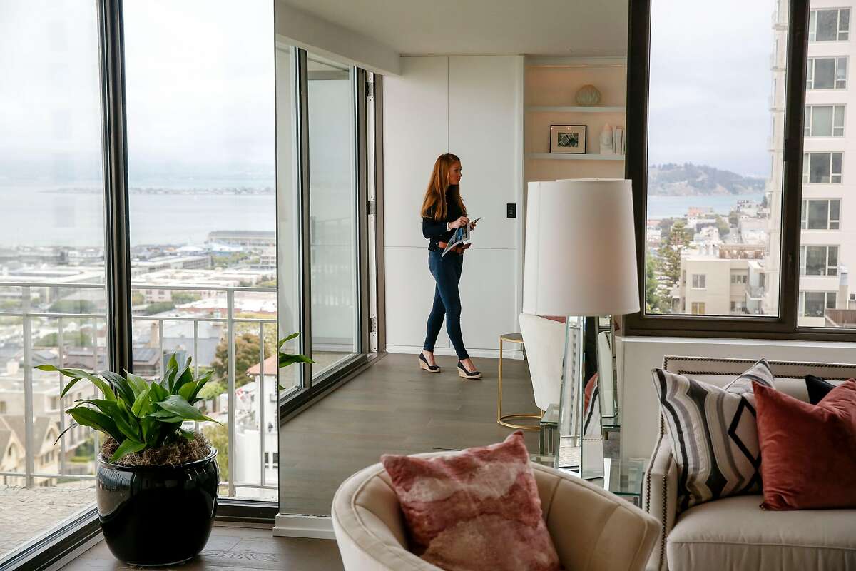 Whitney Hudak looks at a condo at 1080 Chestnut in Russian Hill Wednesday, June 19, 2019, in San Francisco, Calif.